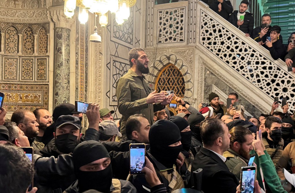 Top rebel commander Abu Mohammed al-Golani speaks to a crowd at Ummayad Mosque in Damascus, after Syrian rebels announced that they had ousted President Bashar al-Assad on December 8, 2024.