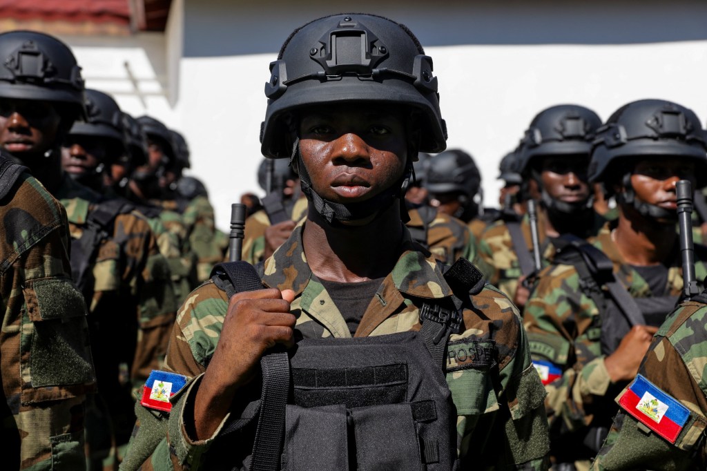 An army contingent trained in Mexico stands in formation during a ceremony marking the 222nd anniversary of the Battle of Vertieres, when Haitian forces led by Jean-Jacques Dessalines defeated French colonial troops, paving the way for Haiti's independence, in Port-au-Prince, Haiti, November 18, 2025. REUTERS/Patrice Noel