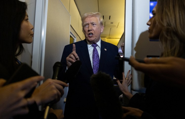 U.S. President Donald Trump speaks to reporters during travel to Washington, D.C., from Palm Beach International Airport, Florida, U.S., November 30, 2025. REUTERS/Anna Rose Layden