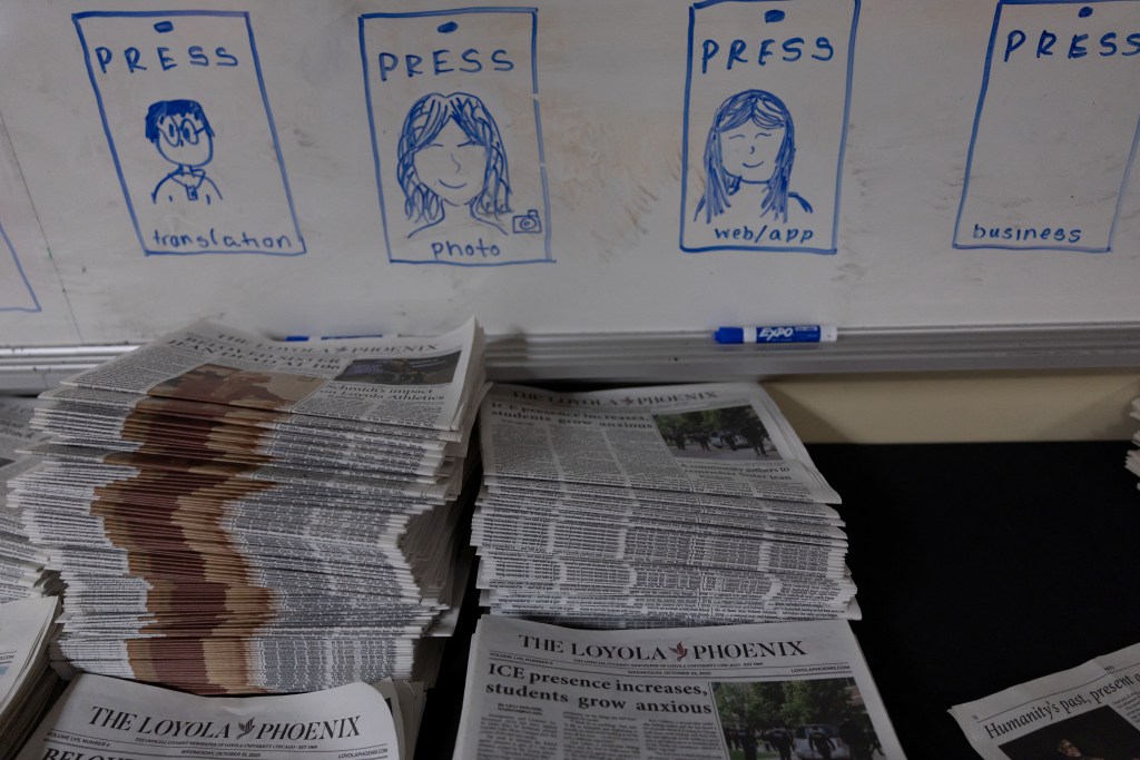 A stack of The Loyola Phoenix newspapers is displayed at the university newsroom in downtown Chicago, Illinois, U.S., November 11, 2025. REUTERS/Carlos Barria