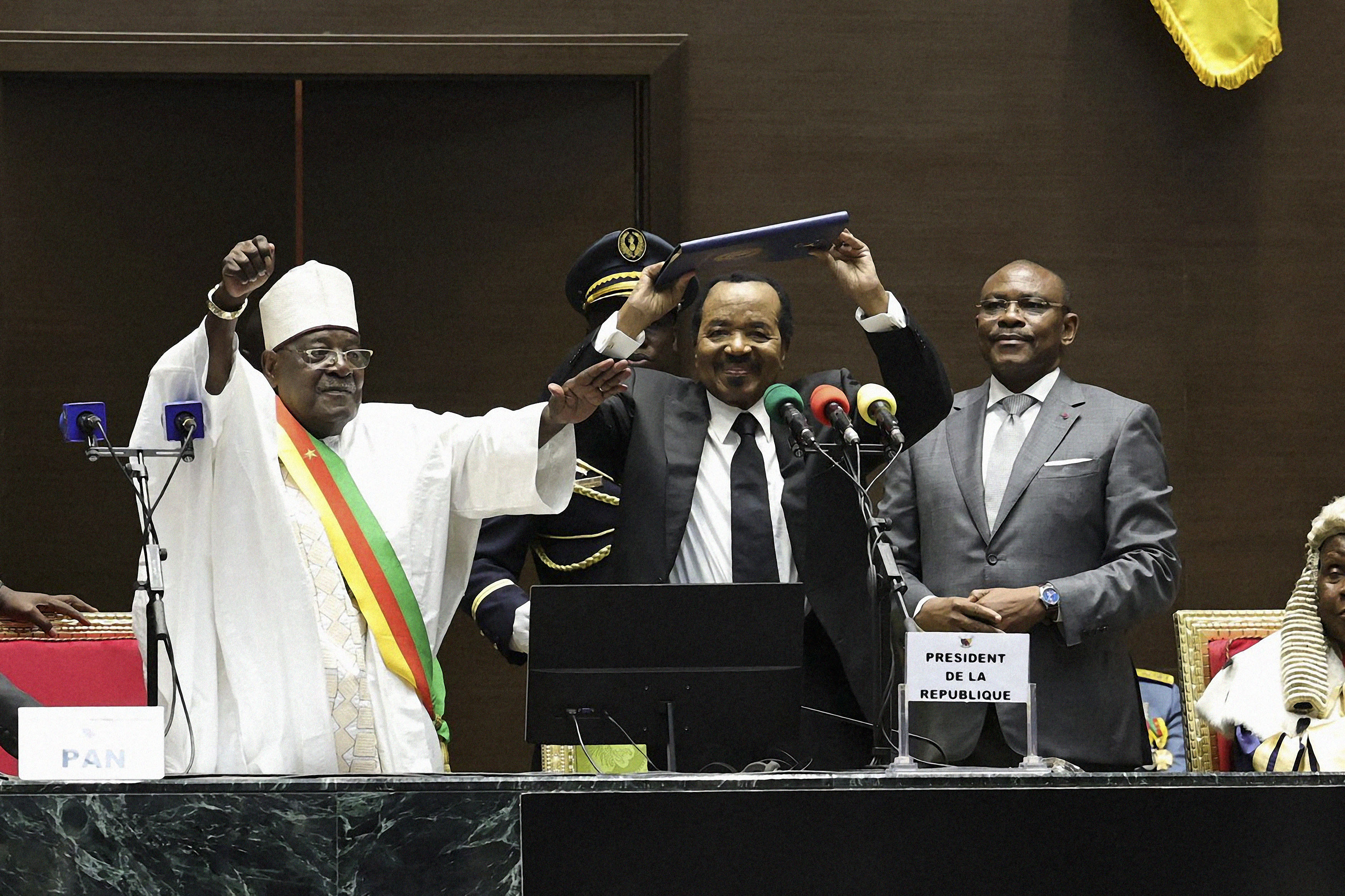 Cameroon President Paul Biya (center) gestures as he celebrates his inauguration at the National Assembly in Yaounde on November 6, 2025.