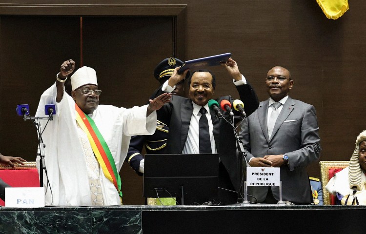 Cameroon President Paul Biya (center) gestures as he celebrates his inauguration at the National Assembly in Yaounde on November 6, 2025.