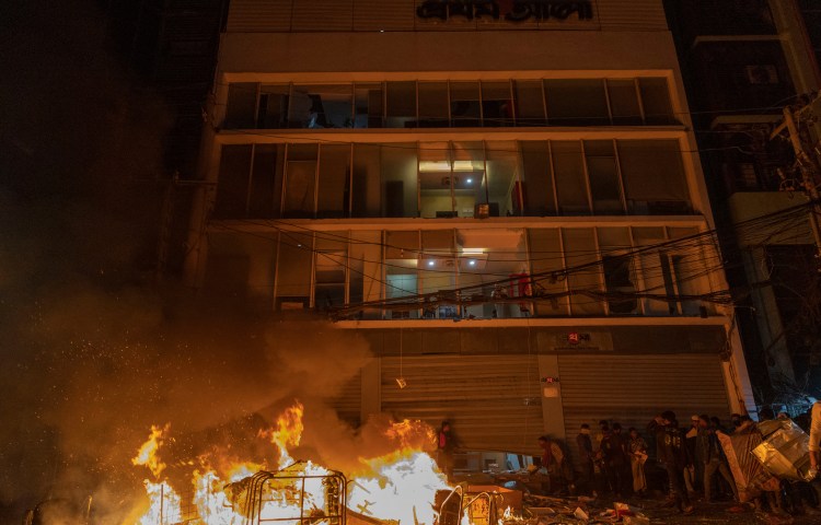 A fire burns outside the Prothom Alo office, which was vandalized in Dhaka on December 19, 2025, amid protests following the news of the youth leader Sharif Osman Hadi’s death. (Photo: AFP/Abdul Goni)