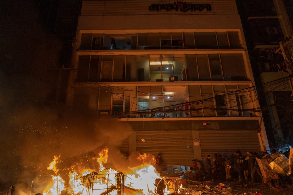 A fire burns outside the Prothom Alo office, which was vandalized in Dhaka on December 19, 2025, amid protests following the news of the youth leader Sharif Osman Hadi’s death. (Photo: AFP/Abdul Goni)