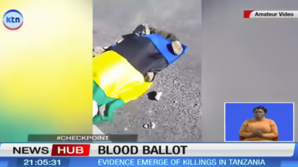 A Kenyan television channel reports on killings in Tanzania, with an image of a body on a street draped in the colours of the Tanzanian flag, on November 2.