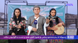 Iraqi Kurdish reporter Omer Ahmed, in the middle, covers the first day of the Beyt and Heyran cultural festival in Sardasht alongside two female musicians before his arrest by Iranian authorities.
