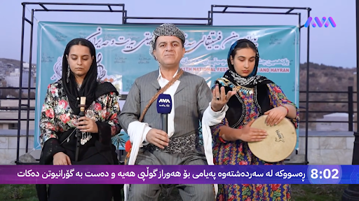 Iraqi Kurdish reporter Omer Ahmed, in the middle, covers the first day of the Beyt and Heyran cultural festival in Sardasht alongside two female musicians before his arrest by Iranian authorities.