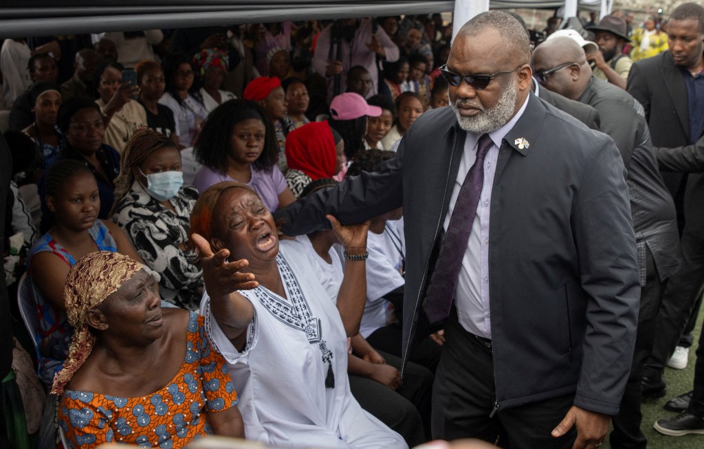 AFC leader Corneille Nangaa consoles relatives of casualties during a funeral for victims of a drone strike in Masisi territory, in Goma on January 8.