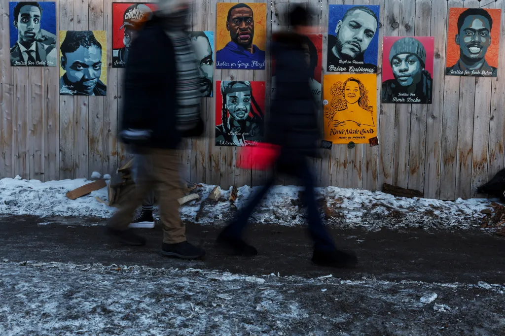 Portraits of individuals killed in incidents with authorities, including George Floyd, Philando Castile, Amir Locke, Daunte Wright, Winston Smith, Isak Aden, and more recently Renee Nicole Good, are displayed on a fence near the site where Good was fatally shot by a U.S. Immigration and Customs Enforcement (ICE) agent on January 7, as people walk by in Minneapolis, Minnesota, U.S., January 29, 2026. REUTERS/Shannon Stapleton