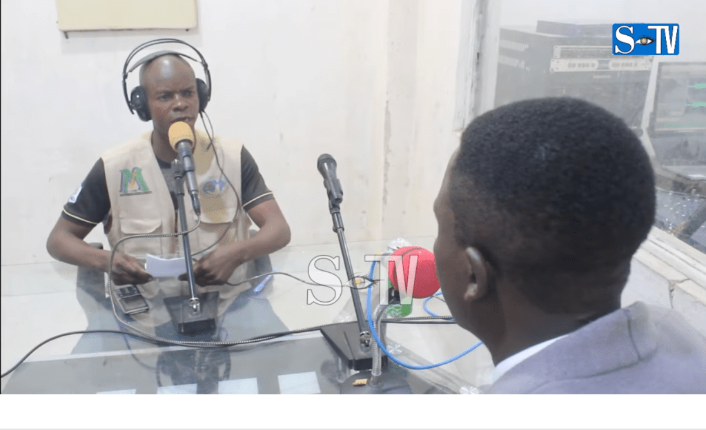 Thomson Unji Batangalwa interviews a local leader about security on Radio Le Messager du Peuple, days after rebels took over the eastern city of Uvira in December. When the government retook the city in January, police detained the journalist.