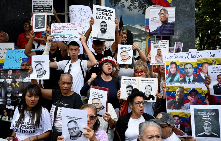 People and family members of detainees gather outside Venezuela's National Assembly as the government pledges to pass an amnesty law to free political prisoners, amid mounting U.S. pressure over a month after the administration of U.S. President Donald Trump captured and deposed long-time leader Nicolas Maduro, in Caracas, Venezuela February 10, 2026. REUTERS/Maxwell Briceno TPX IMAGES OF THE DAY