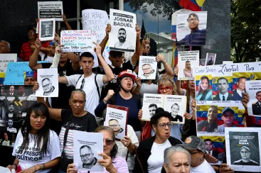 People and family members of detainees gather outside Venezuela's National Assembly as the government pledges to pass an amnesty law to free political prisoners, amid mounting U.S. pressure over a month after the administration of U.S. President Donald Trump captured and deposed long-time leader Nicolas Maduro, in Caracas, Venezuela February 10, 2026. REUTERS/Maxwell Briceno TPX IMAGES OF THE DAY