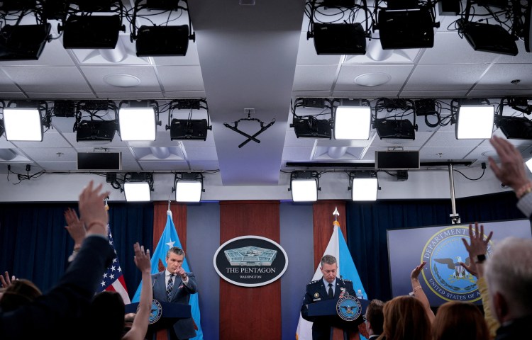 U.S. Secretary of Defense Pete Hegseth and Chairman of the Joint Chiefs of Staff General Dan Caine hold a briefing amid the U.S.-Israeli war on Iran, at the Pentagon in Washington, D.C., U.S., March 19, 2026. REUTERS/Evan Vucci TPX IMAGES OF THE DAY