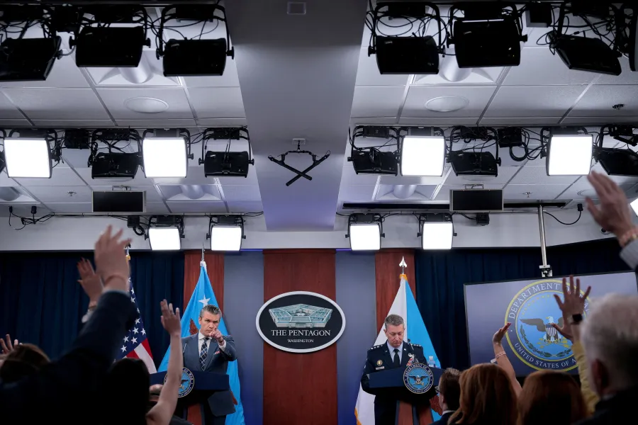 U.S. Secretary of Defense Pete Hegseth and Chairman of the Joint Chiefs of Staff General Dan Caine hold a briefing amid the U.S.-Israeli war on Iran, at the Pentagon in Washington, D.C., U.S., March 19, 2026. REUTERS/Evan Vucci TPX IMAGES OF THE DAY