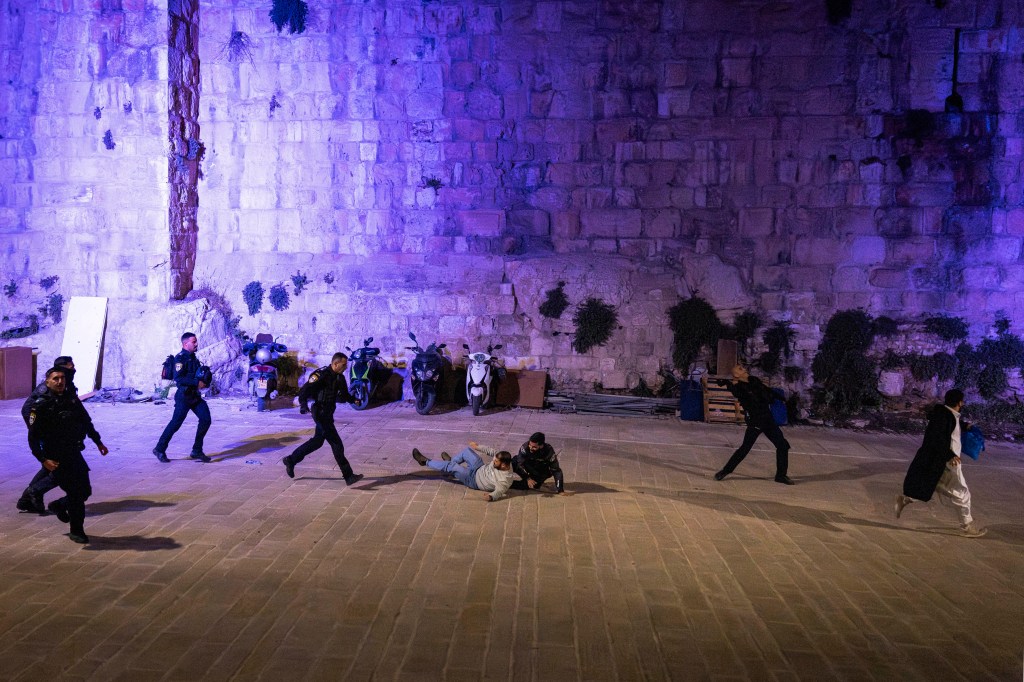 Israeli security forces violently disperse Muslim worshippers who were performing the nightly Tarawih prayers during the Muslim holy month of Ramadan outside the old city walls of Jerusalem on March 17, 2026, while the Aqsa mosque compound remains closed.