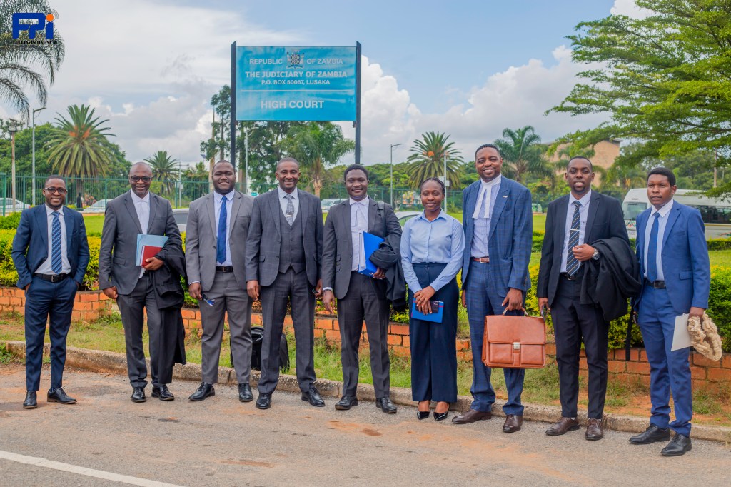 Lawyers challenging the constitutionality of the Zambia's cyber laws outside the High Court in 2026.
