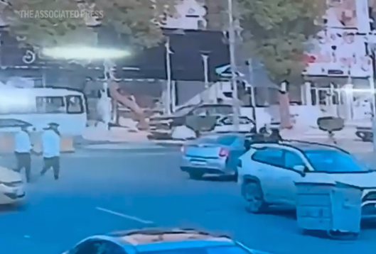 Video shows Shelly Kittleson being pushed into a car by two men on a street corner.