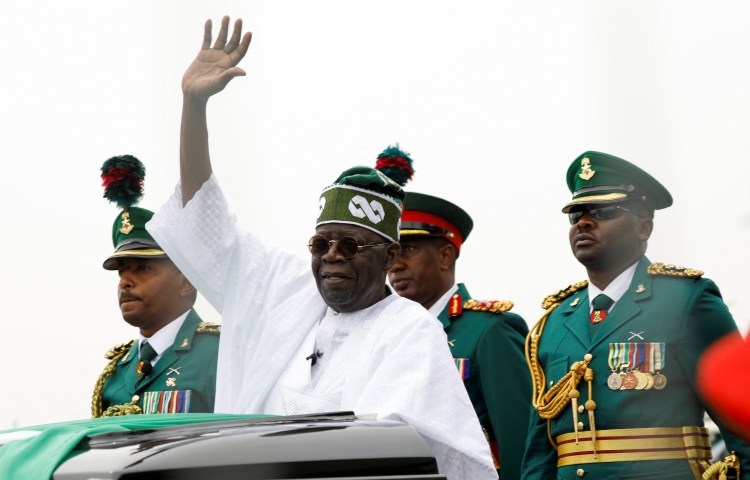 President Bola Tinubu waves during his swearing-in ceremony in the Nigerian capital, Abuja, on May 29, 2023.
