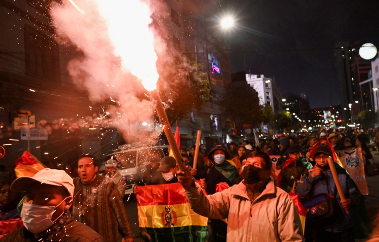 Demonstrators take part in a march, which organizers have dubbed a "defense of democracy," to rally against road blockades and what they call pressure measures used by protesters calling for the resignation of Bolivia’s President Rodrigo Paz, amid the country’s economic and fuel crisis, in La Paz, Bolivia, May 20, 2026. REUTERS/Claudia Morales REFILE - REWRITING FOR CLARITY AND ADDING ATTRIBUTION