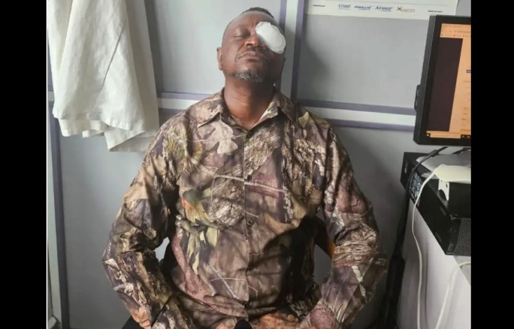 Journalist Allwell Ene in a hospital