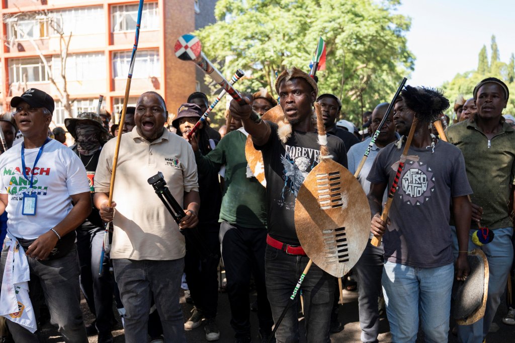 Protesters call for stronger government action against illegal immigration in Pretoria, South Africa, on April 28.