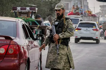 A Taliban policeman directs traffic in Kabul on August 14, 2025. Armed Taliban agents raided Tamadon TV’s headquarters in the city and forced the broadcaster off the air on June 23, 2026. (Photo: AP/Siddiqullah Alizai)