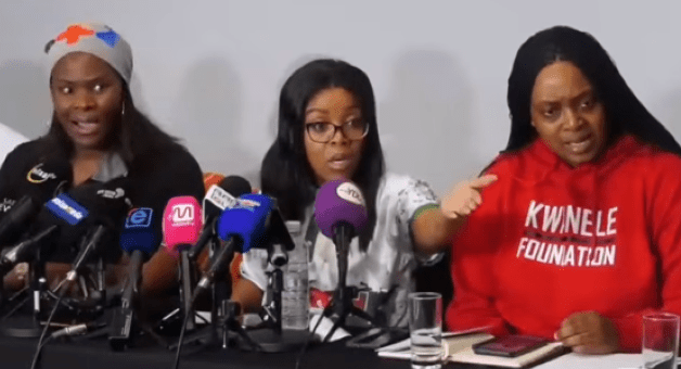 March and March founder Jacinta Ngobese-Zuma (center) and her supporters heckle journalist Kgaogelo Magolego at a news conference in June.