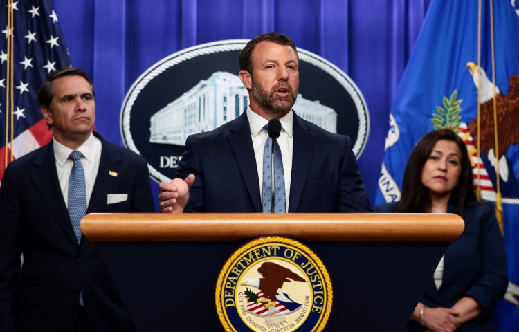U.S. Secretary of Homeland Security Markwayne Mullin speaks during a press conference hosted with Acting U.S. Attorney General Todd Blanche on unaccompanied minors and prosecuting their sponsors, at the Justice Department, in Washington, D.C., U.S., June 11, 2026. REUTERS/Evelyn Hockstein
