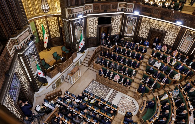 Members of Syria's newly formed People's Assembly attend the body's inaugural session, the first parliament session since the end of the rule of ousted Syrian President Bashar al-Assad, in Damascus, Syria, July 12, 2026.