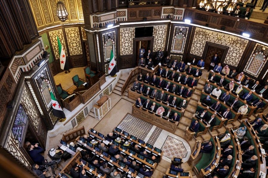 Members of Syria's newly formed People's Assembly attend the body's inaugural session, the first parliament session since the end of the rule of ousted Syrian President Bashar al-Assad, in Damascus, Syria, July 12, 2026.