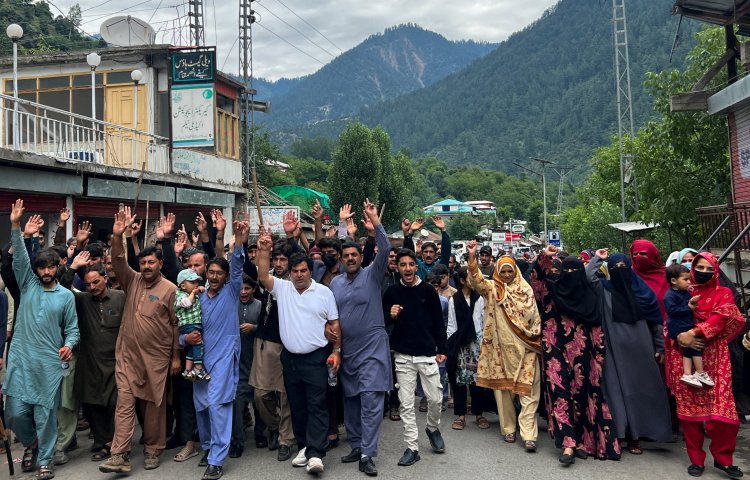 People chant slogans as they protest in Neelum Valley, Pakistani Kashmir, in June.