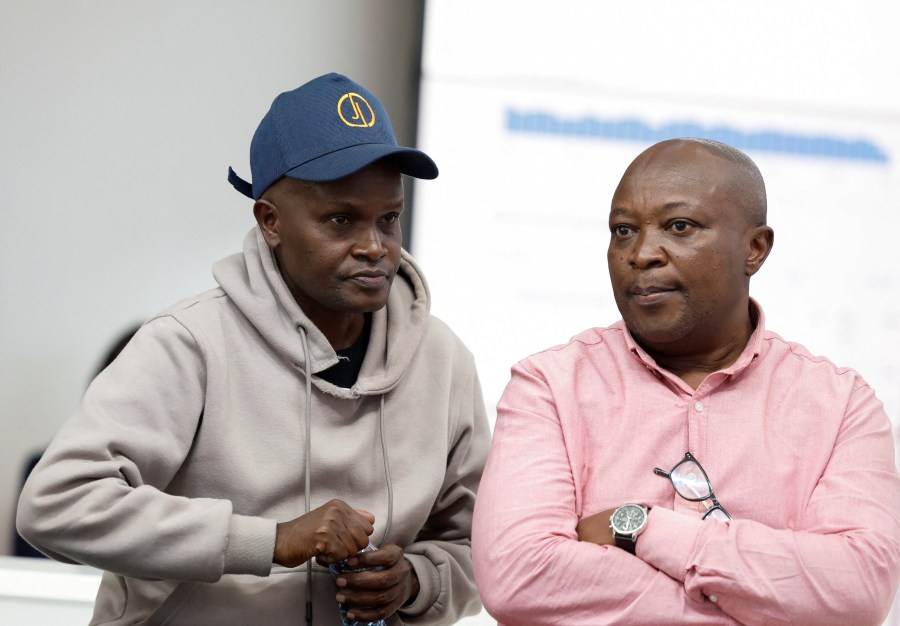 Alex Kiprotich, an associate editor for Standard Group, who was seized by armed men and released hours later, sits with Group CEO Chaacha Mwita, during a news conference at the Standard Group offices in Nairobi, Kenya, on September 2.