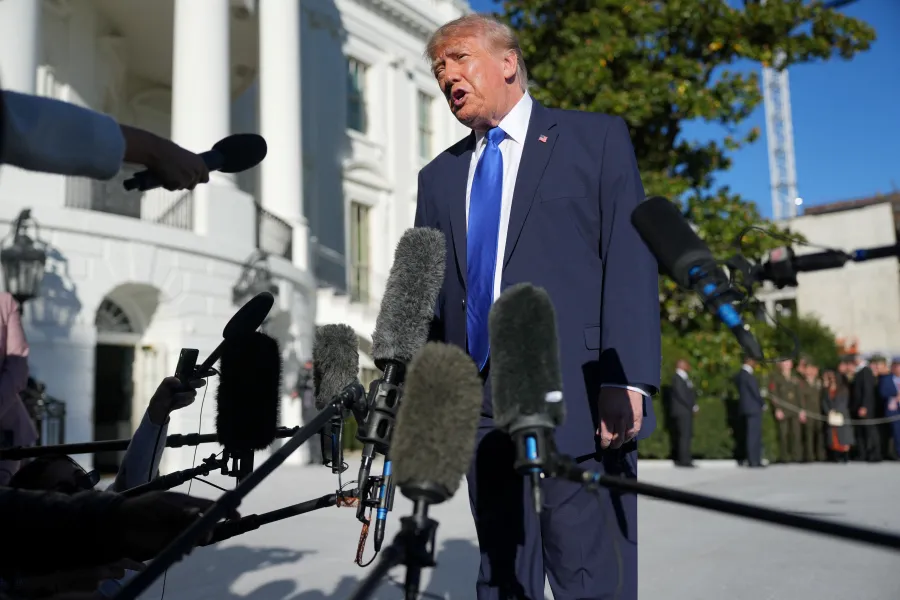 US President Donald Trump speaks to members of the media as he departs the White House en route to Iowa, in Washington, DC, US, October 22, 2026. REUTERS/Nathan Howard