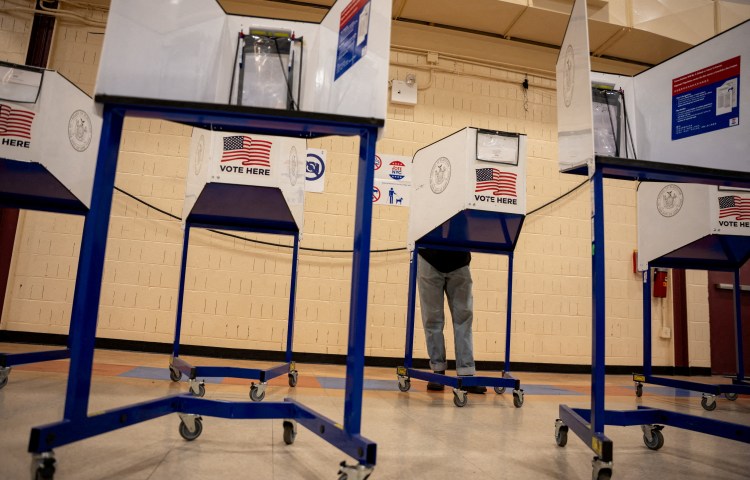 A voter casts their ballot at a polling station during early voting for the mayoral election in Brooklyn, New York City, US, October 25, 2025. (Photo: Reuters/Angelina Katsanis)